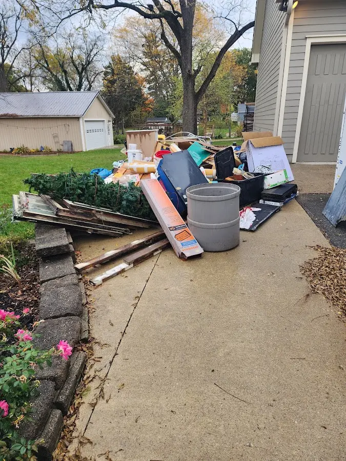 Dumpster being loaded with debris for 3 Yard Dumpster Rental in Southampton